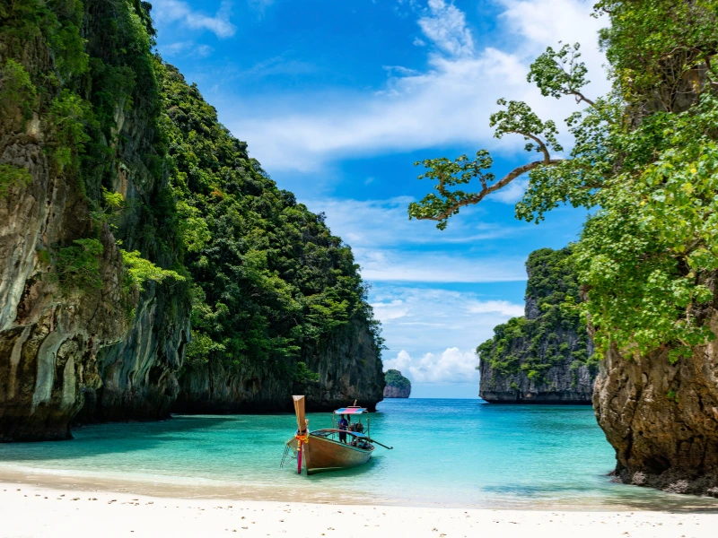 Cheap Beach Vacations-Relaxing tropical beach with palm trees, clear blue water, and budget travelers enjoying an affordable seaside vacation